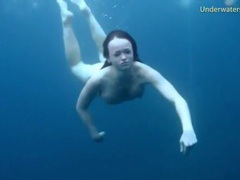 FreeKiloPorn presents: Three ladies get naked swimming in the ocean