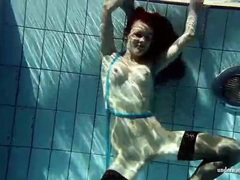 FreeKiloPorn presents: In black stockings pretty girl goes for a swim