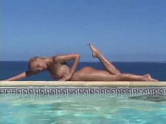 FreeKiloPorn presents: Blonde strips from bikini and takes a dip