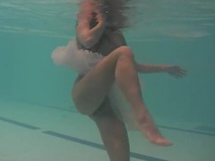 FreeKiloPorn presents: Sheer white dress on a teen swimming in the pool