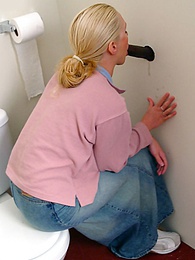 FreeKiloPorn presents: Blonde girl Jamie sits on the toilet and blows a black gloryhole dong